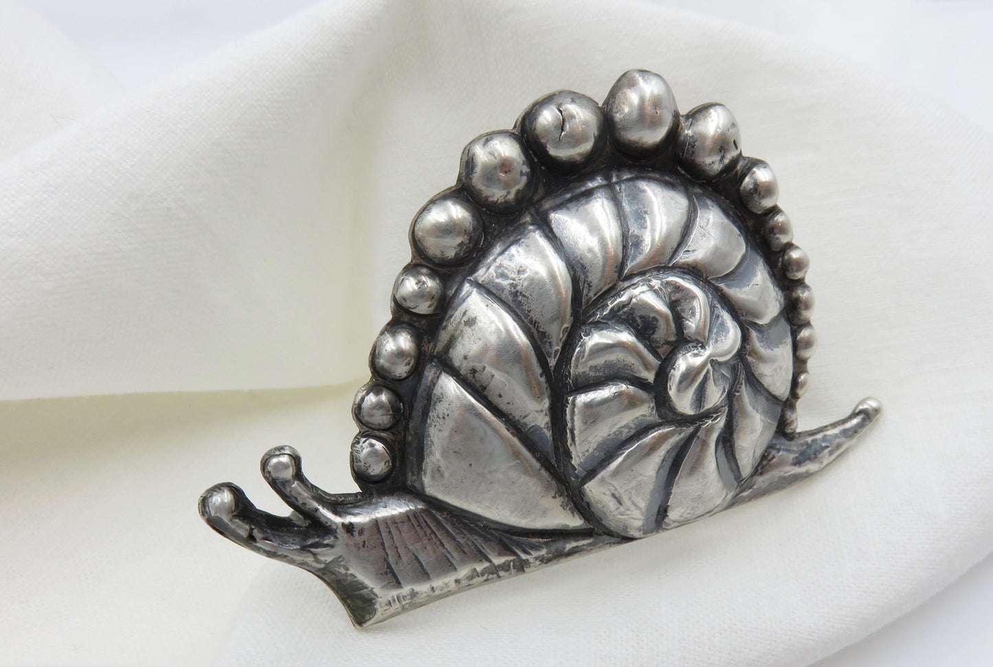 Circa 1940. Made in Mexico Casa Prieto Silver Snail Brooch