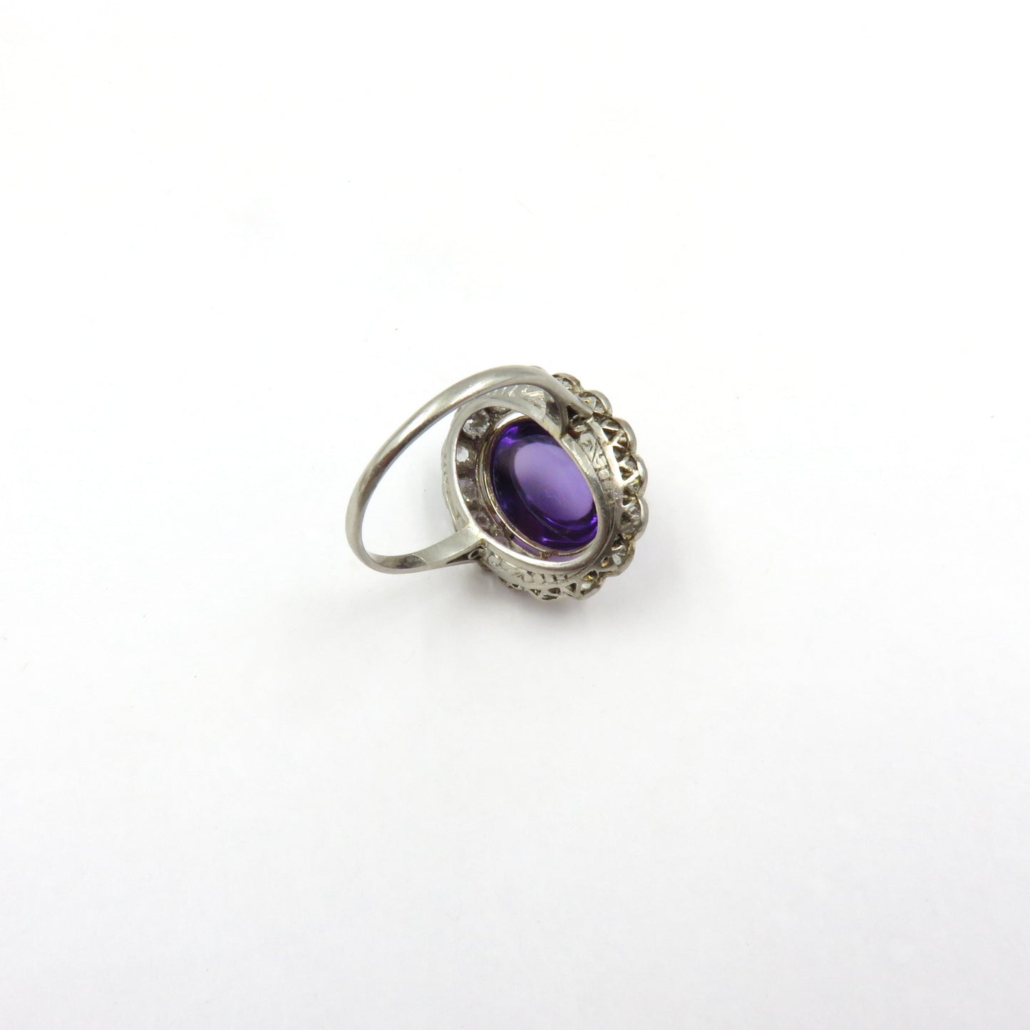 Circa 1920 Platinum Ring Set with Cabochon Amethyst and Old European Cut Diamonds