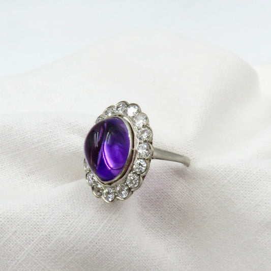 Circa 1920 Platinum Ring Set with Cabochon Amethyst and Old European Cut Diamonds