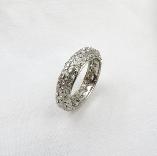 Circa 1920. Diamond  and Platinum Eternity Band.  Three rows of Diamonds