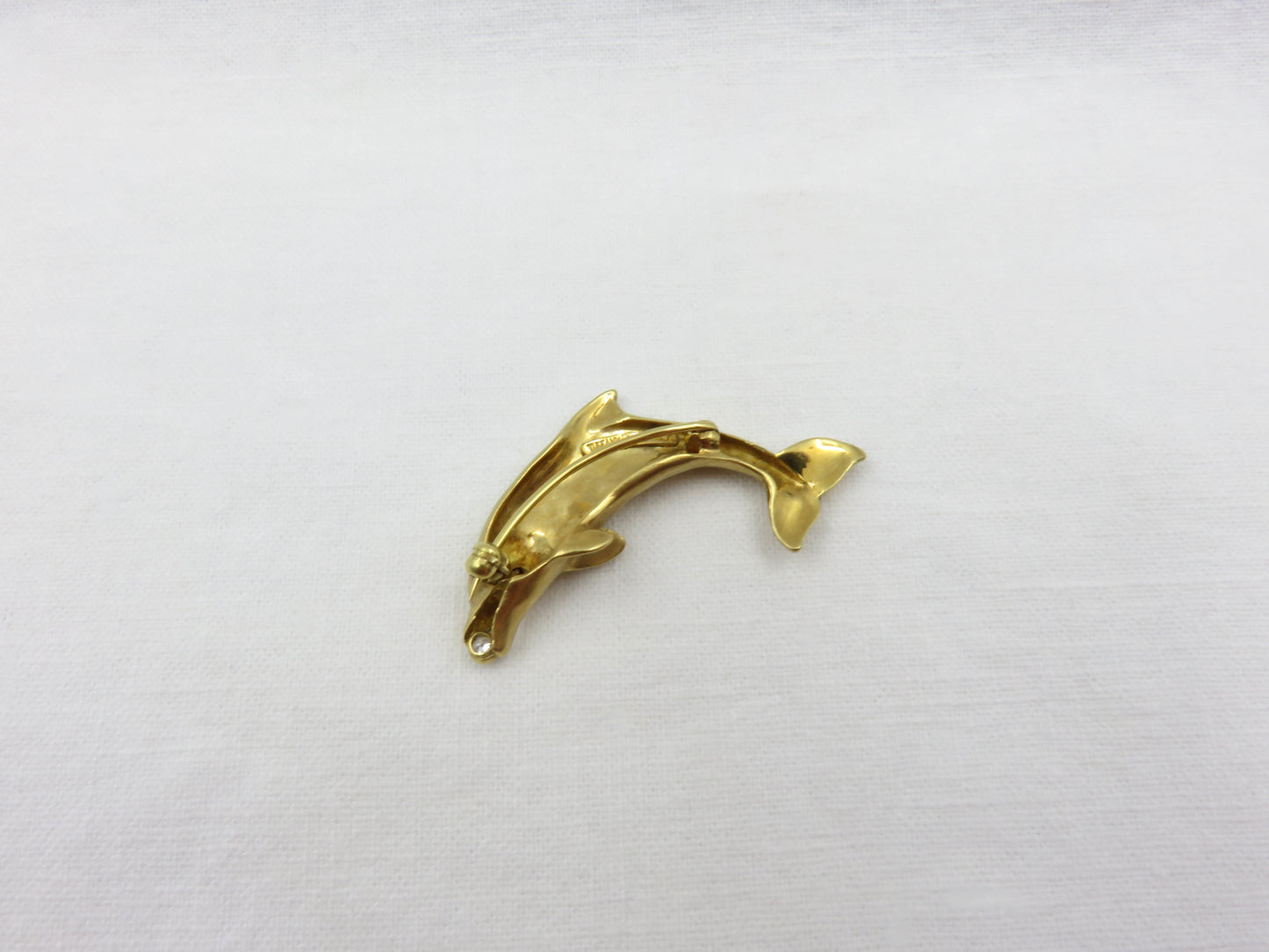 Circa 1970 Tiffany 18karat Gold Diamond and Sapphire Dolphin Pin