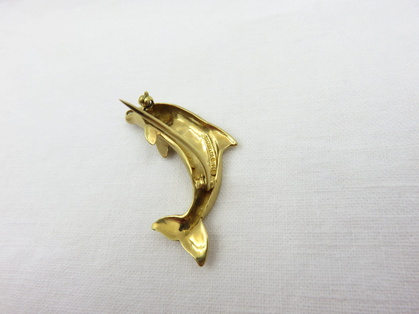 Circa 1970 Tiffany 18karat Gold Diamond and Sapphire Dolphin Pin