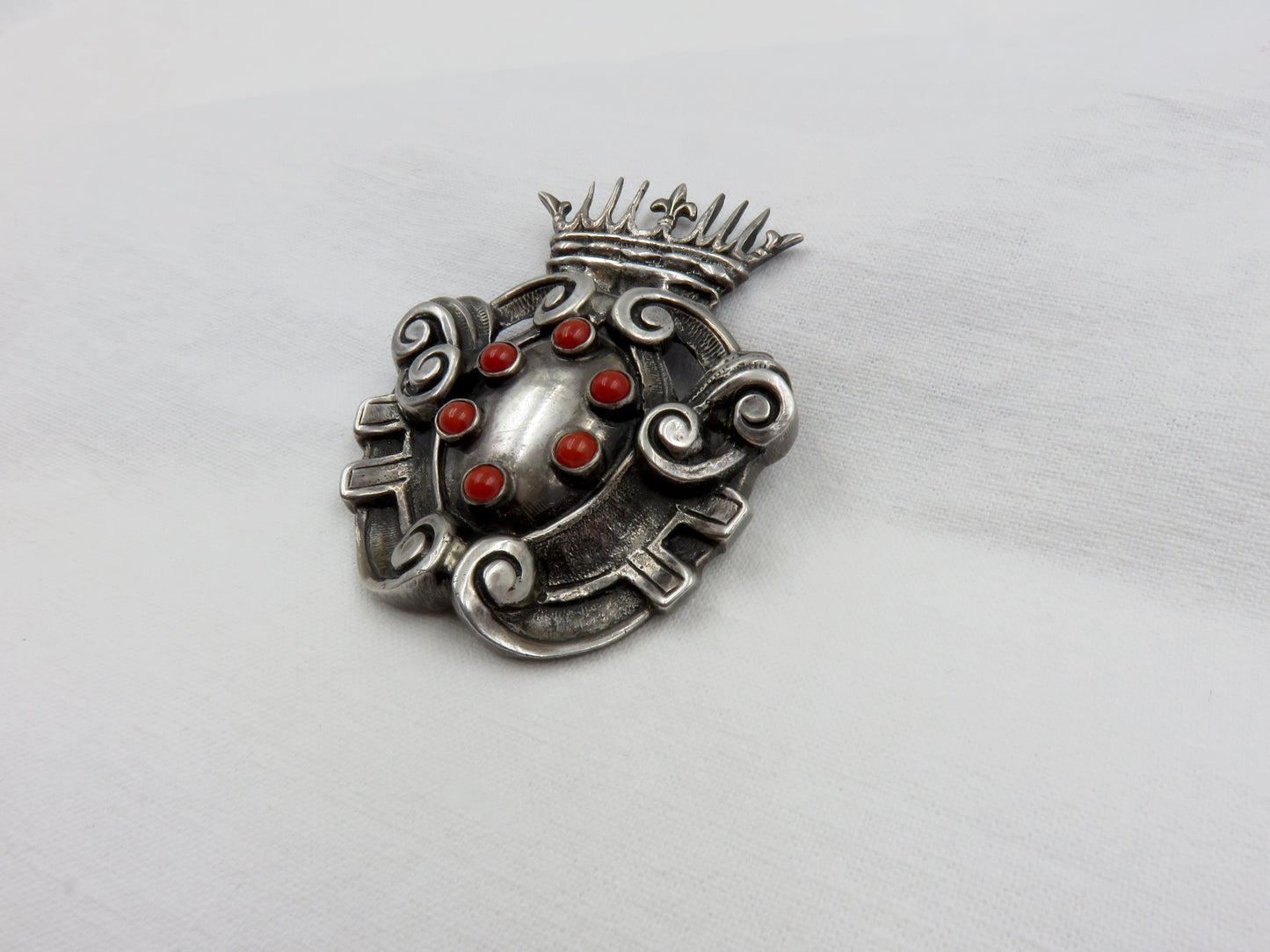 Circa Late 19th Century Silver and Coral Shield and Crown Brooch