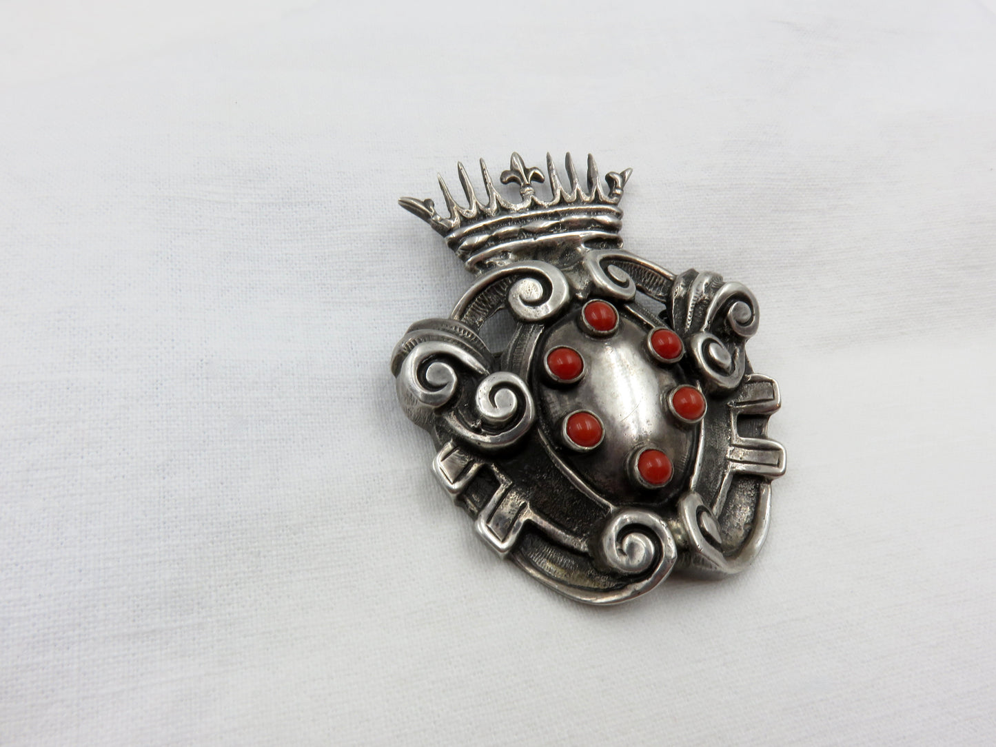 Circa Late 19th Century Silver and Coral Shield and Crown Brooch