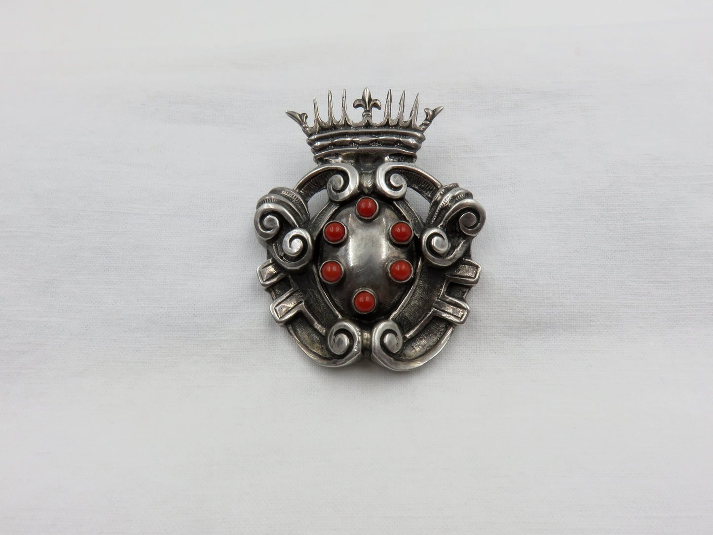 Circa Late 19th Century Silver and Coral Shield and Crown Brooch