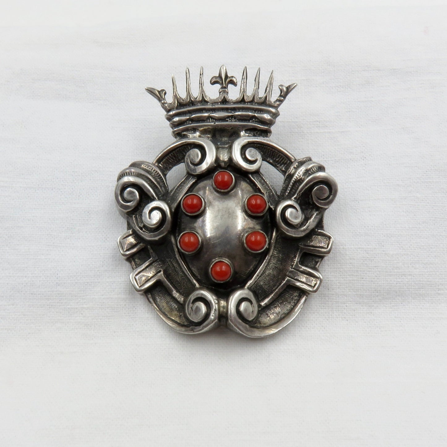 Circa Late 19th Century Silver and Coral Shield and Crown Brooch