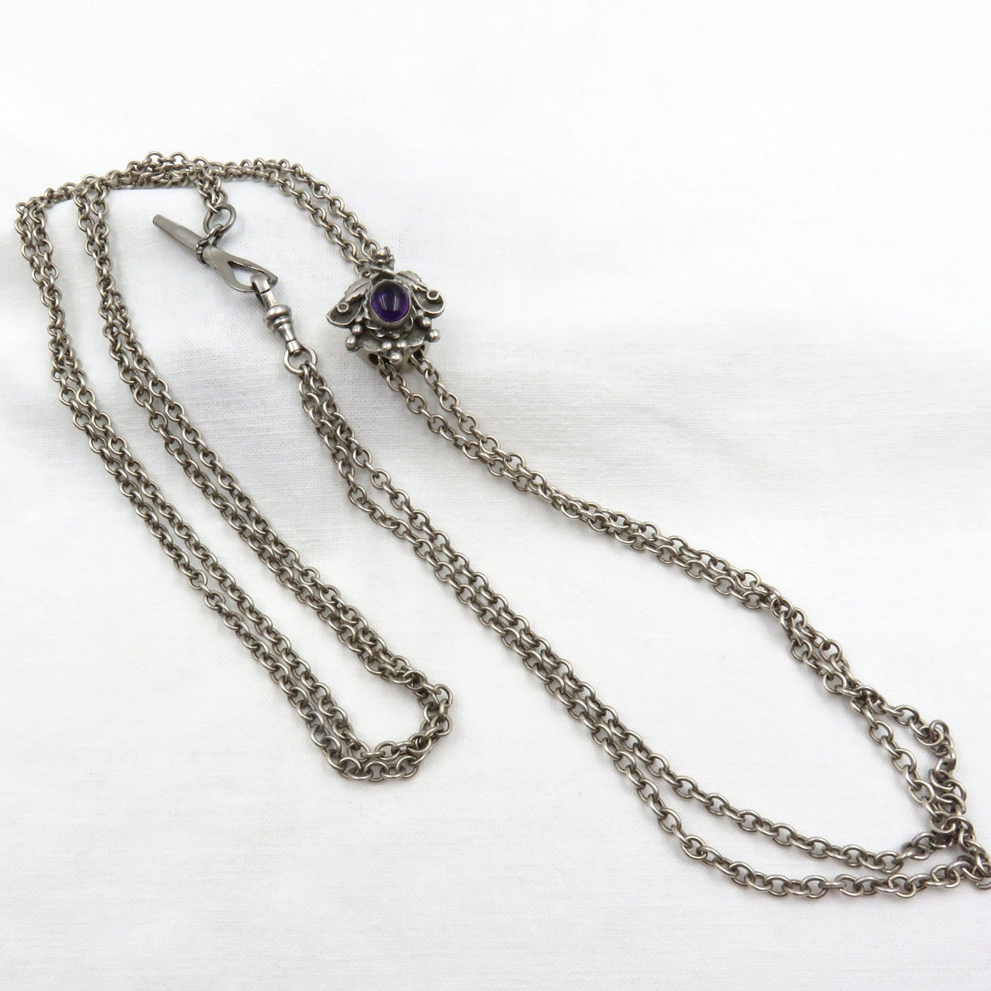 Circa 1890.  Victorian Silver and Amethyst Watch Chain/Slide Chain