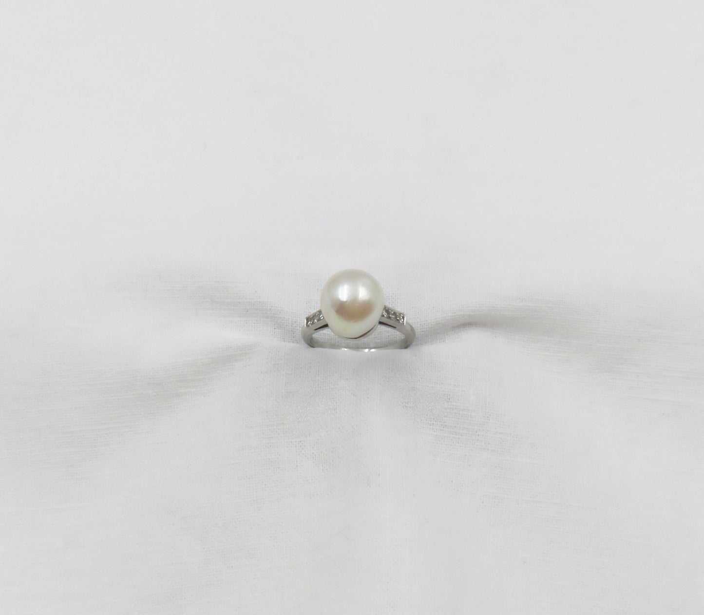 Circa 1950 Platinum ring with Cultured Pearl and Diamonds