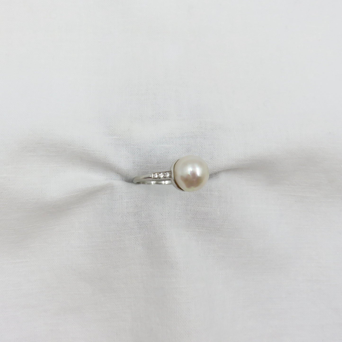 Circa 1950 Platinum ring with Cultured Pearl and Diamonds