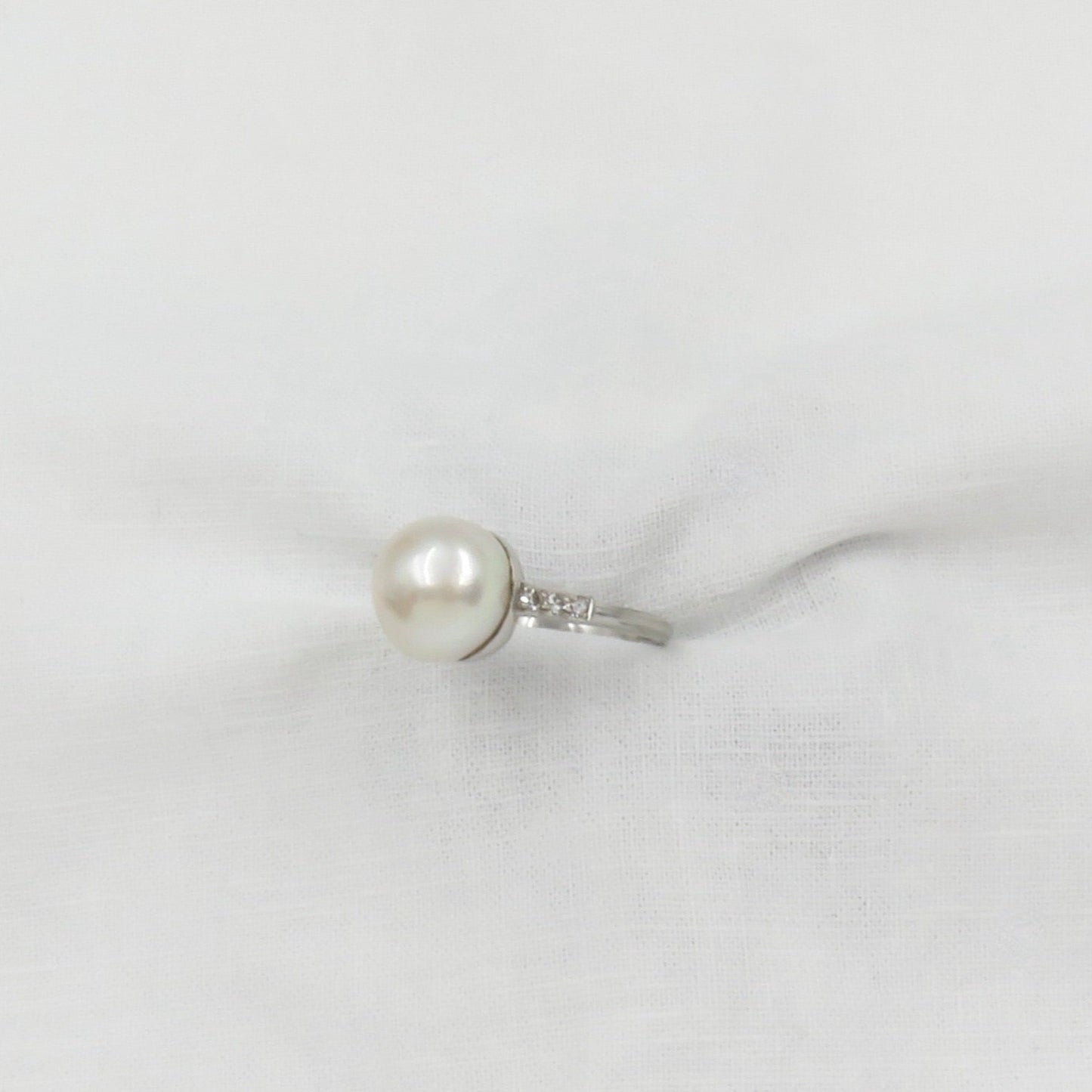 Circa 1950 Platinum ring with Cultured Pearl and Diamonds