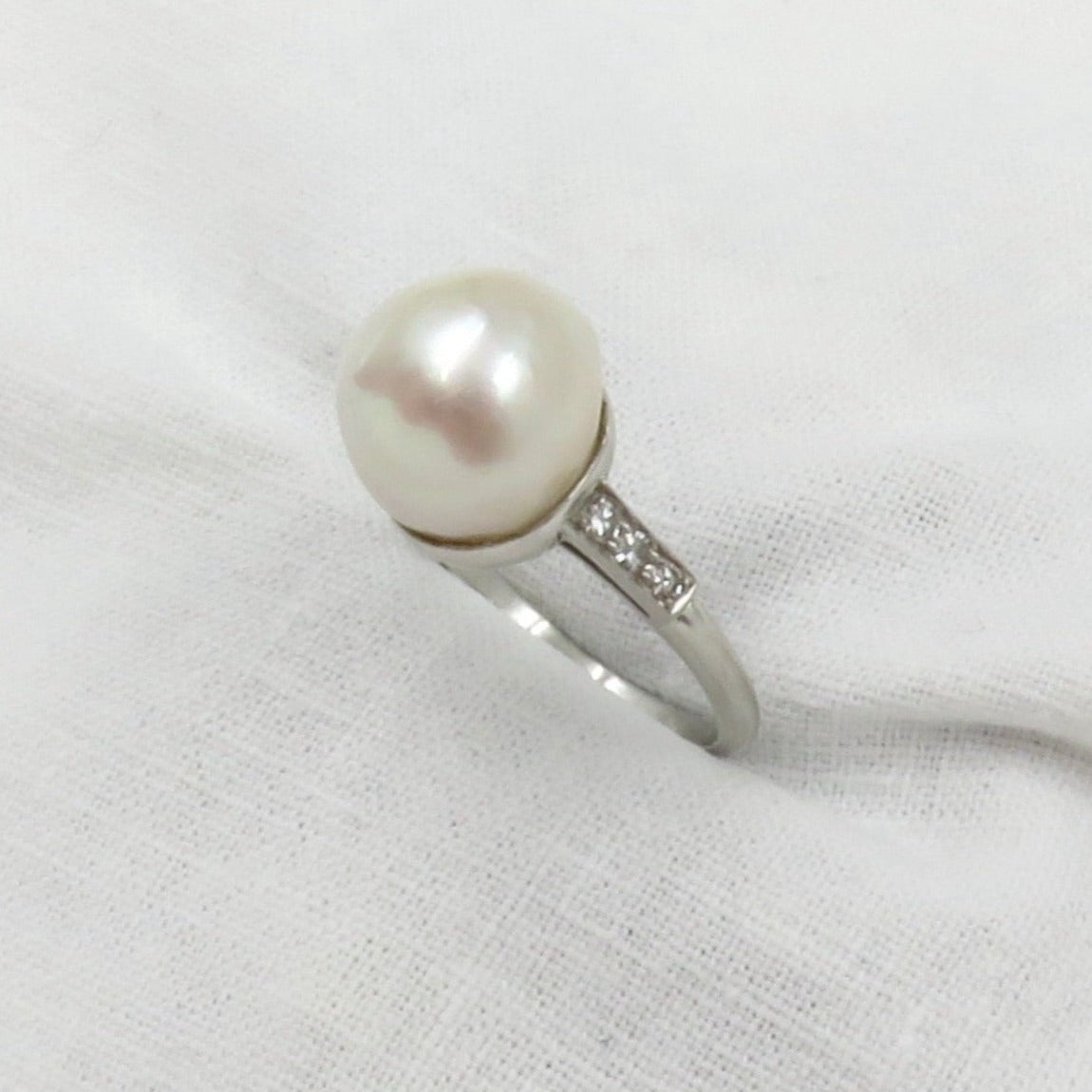 Circa 1950 Platinum ring with Cultured Pearl and Diamonds