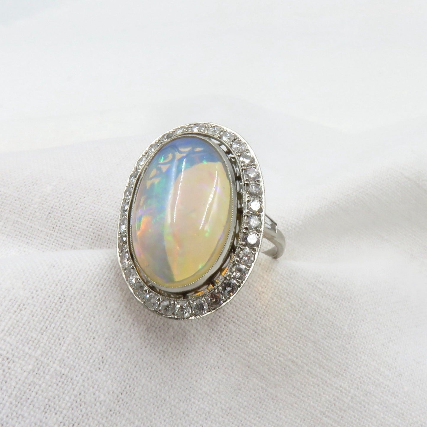 Mid Century Era 8.83 - Carat Oval Cabochon Cut Natural Crystal Opal And Diamond Ring