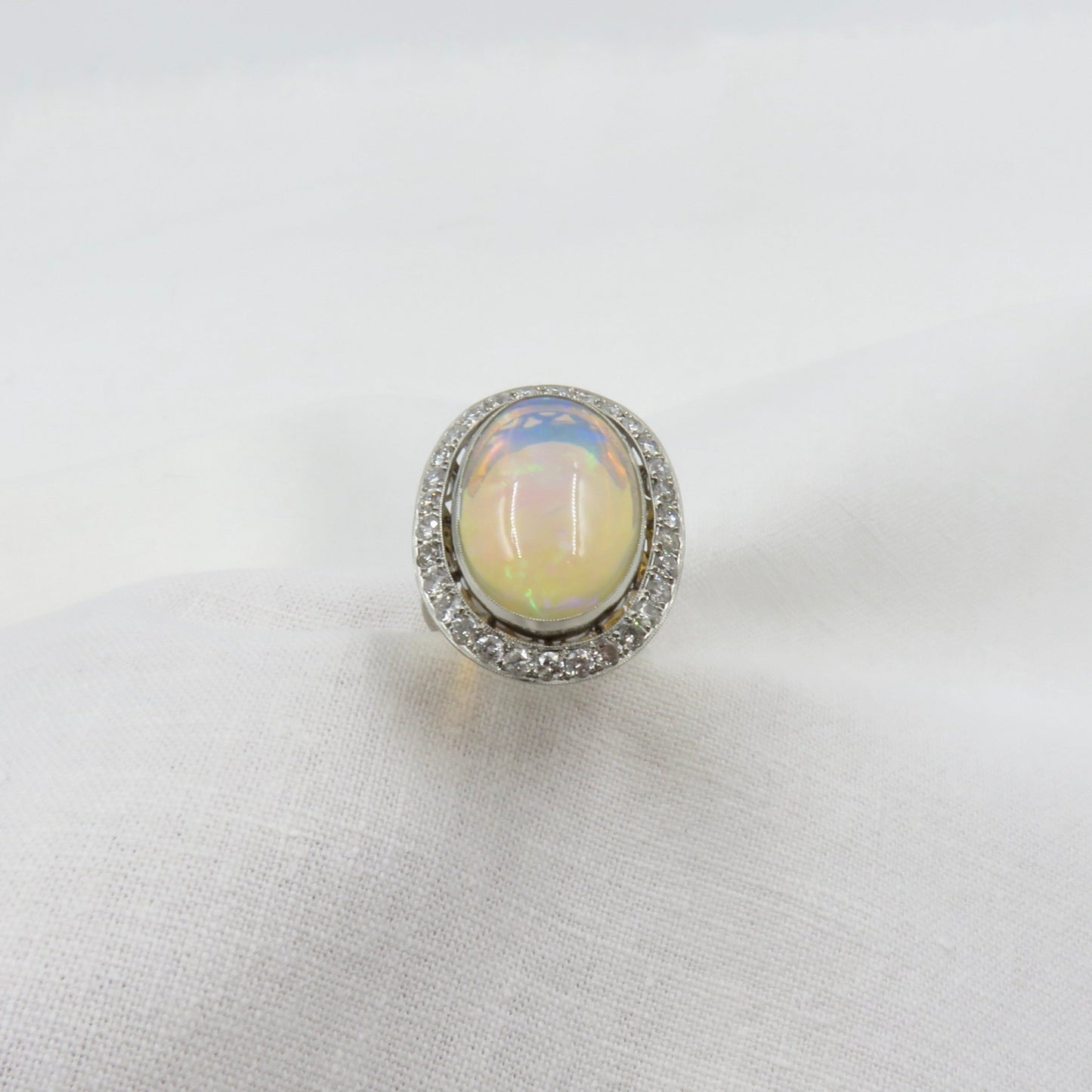 Mid Century Era 8.83 - Carat Oval Cabochon Cut Natural Crystal Opal And Diamond Ring