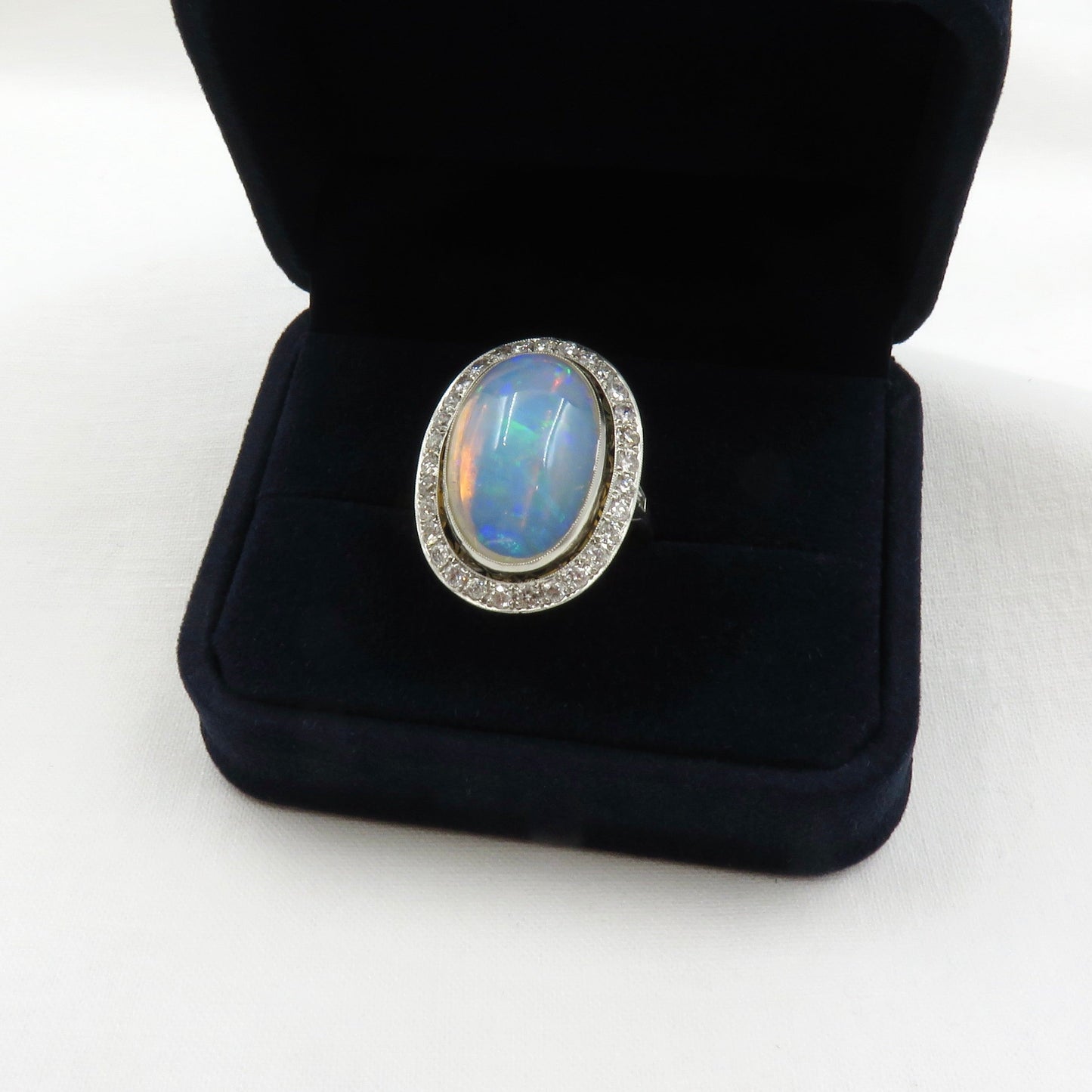 Mid Century Era 8.83 - Carat Oval Cabochon Cut Natural Crystal Opal And Diamond Ring