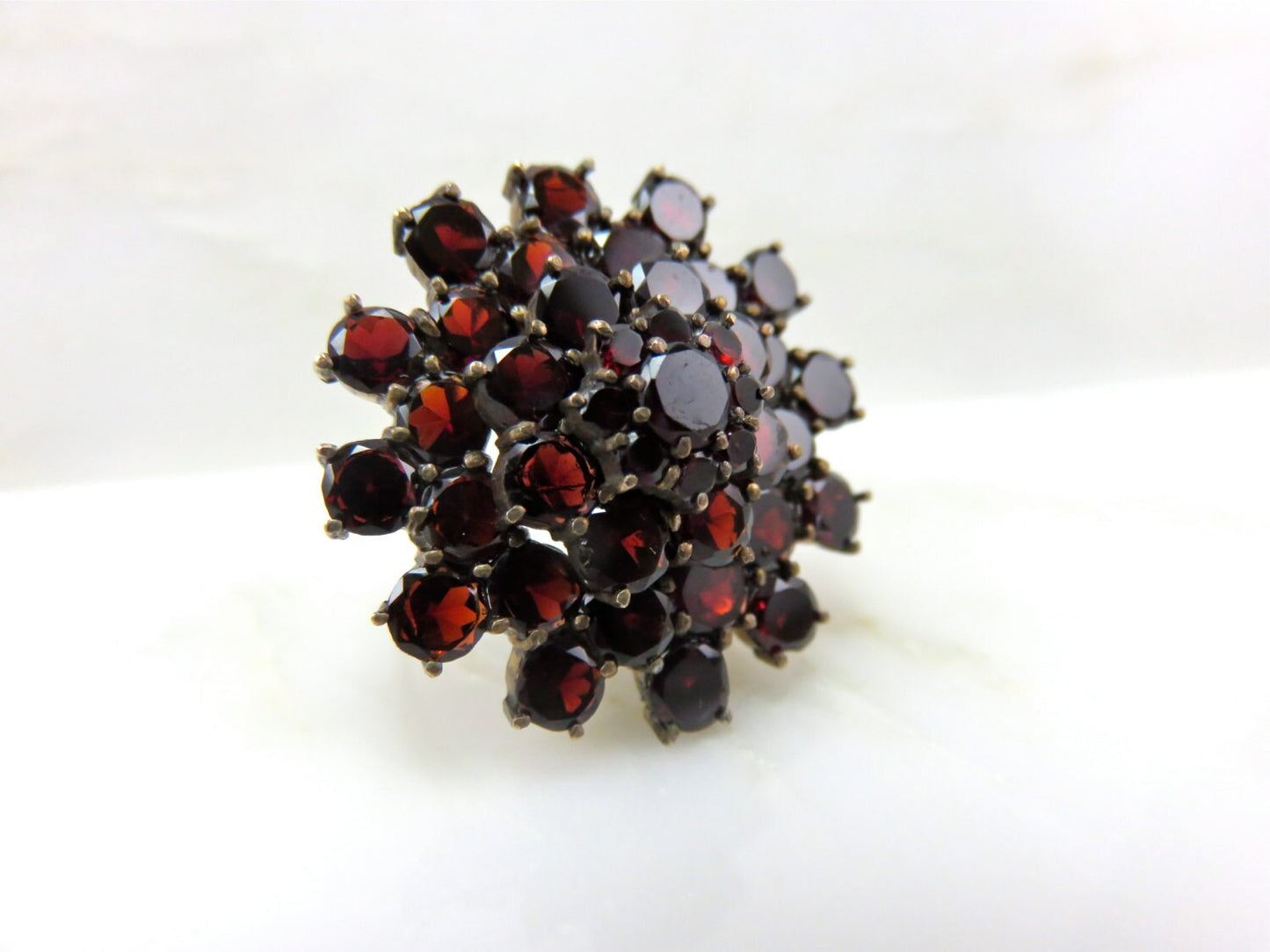 Circa 1930 Garnet Cluster ring set in 14 karat gold