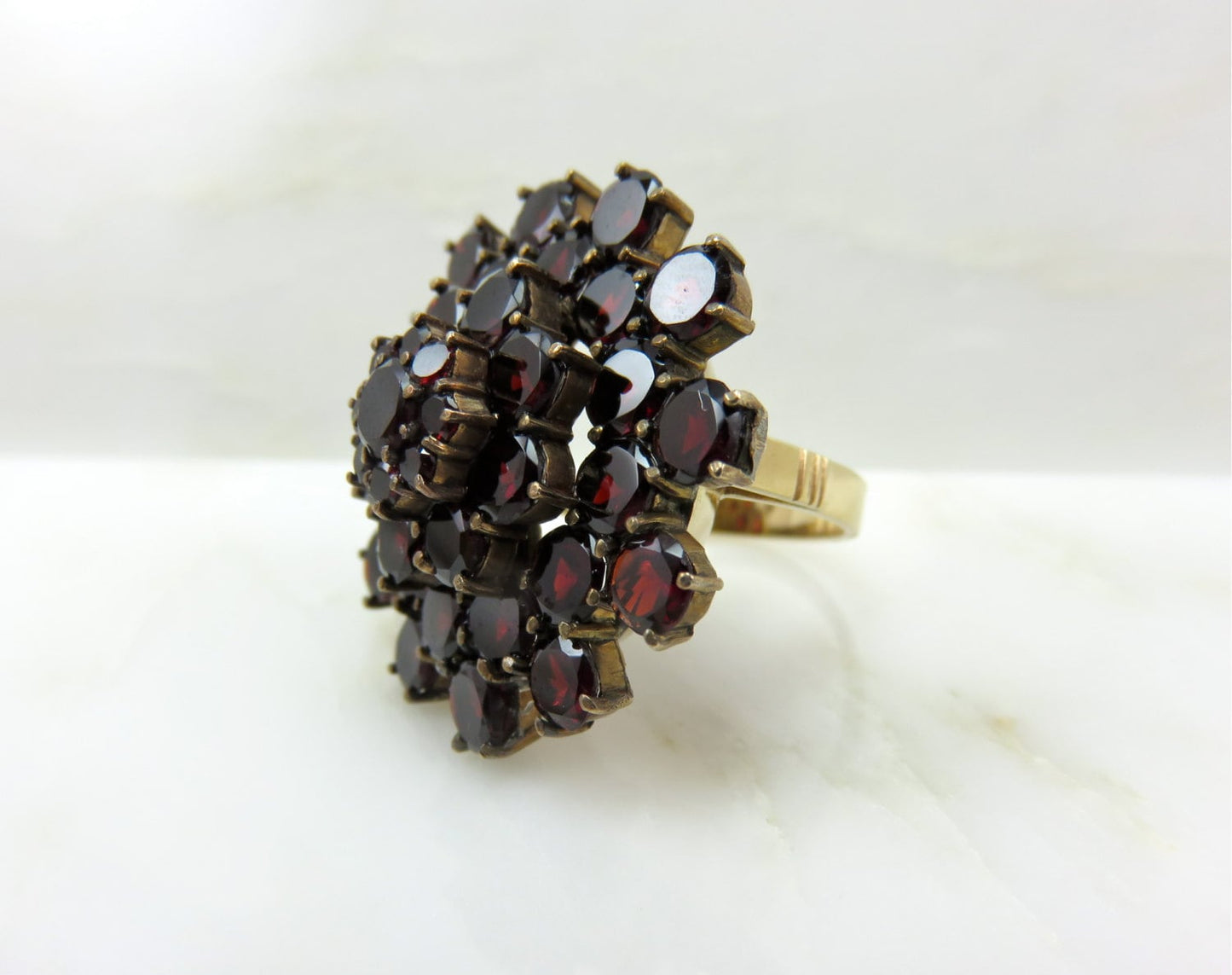 Circa 1930 Garnet Cluster ring set in 14 karat gold