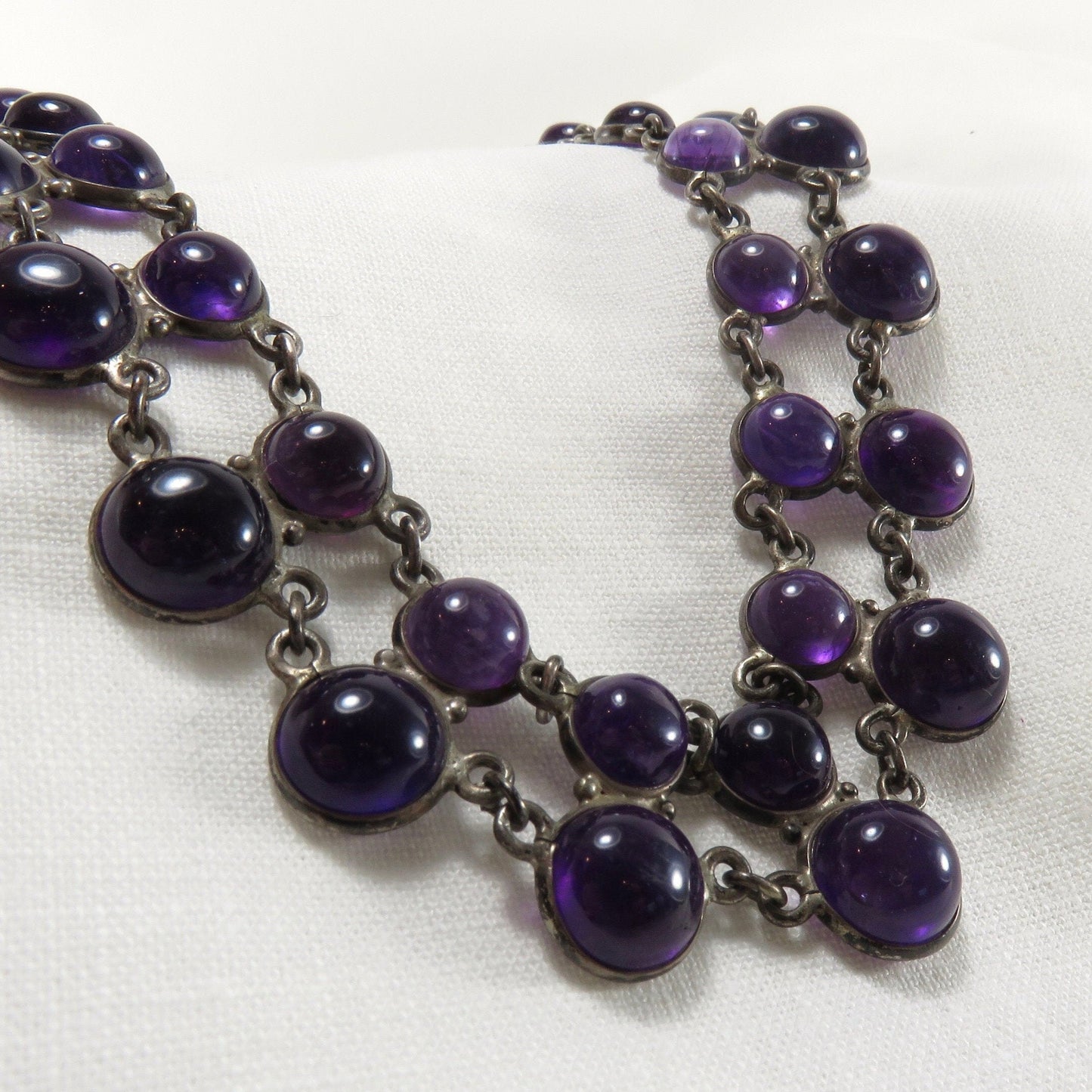 Circa 1940. Double Strand Bezel Set Cabochon Amethyst Necklace