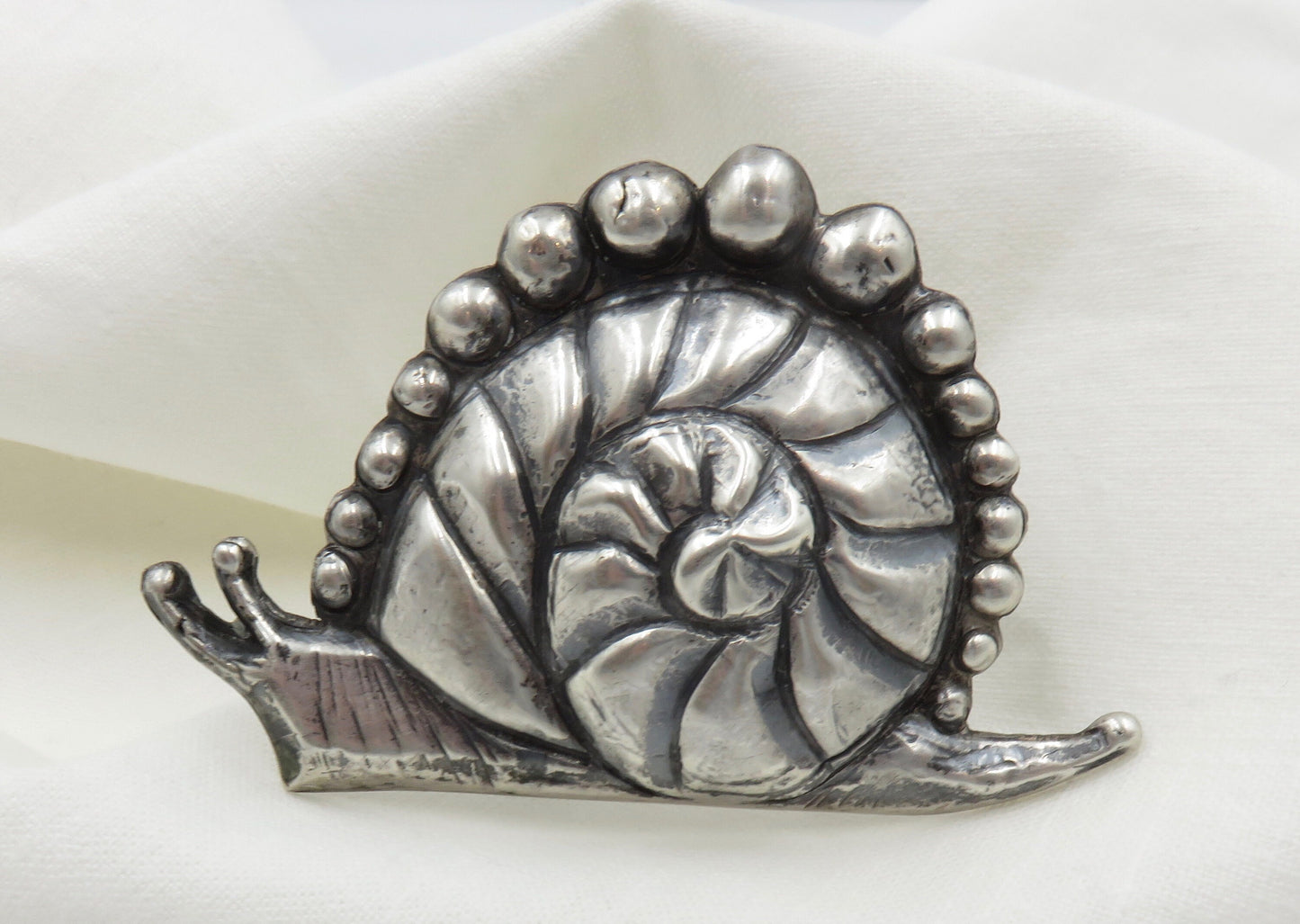 Circa 1940.  Made in Mexico Casa Prieto Silver Snail Brooch