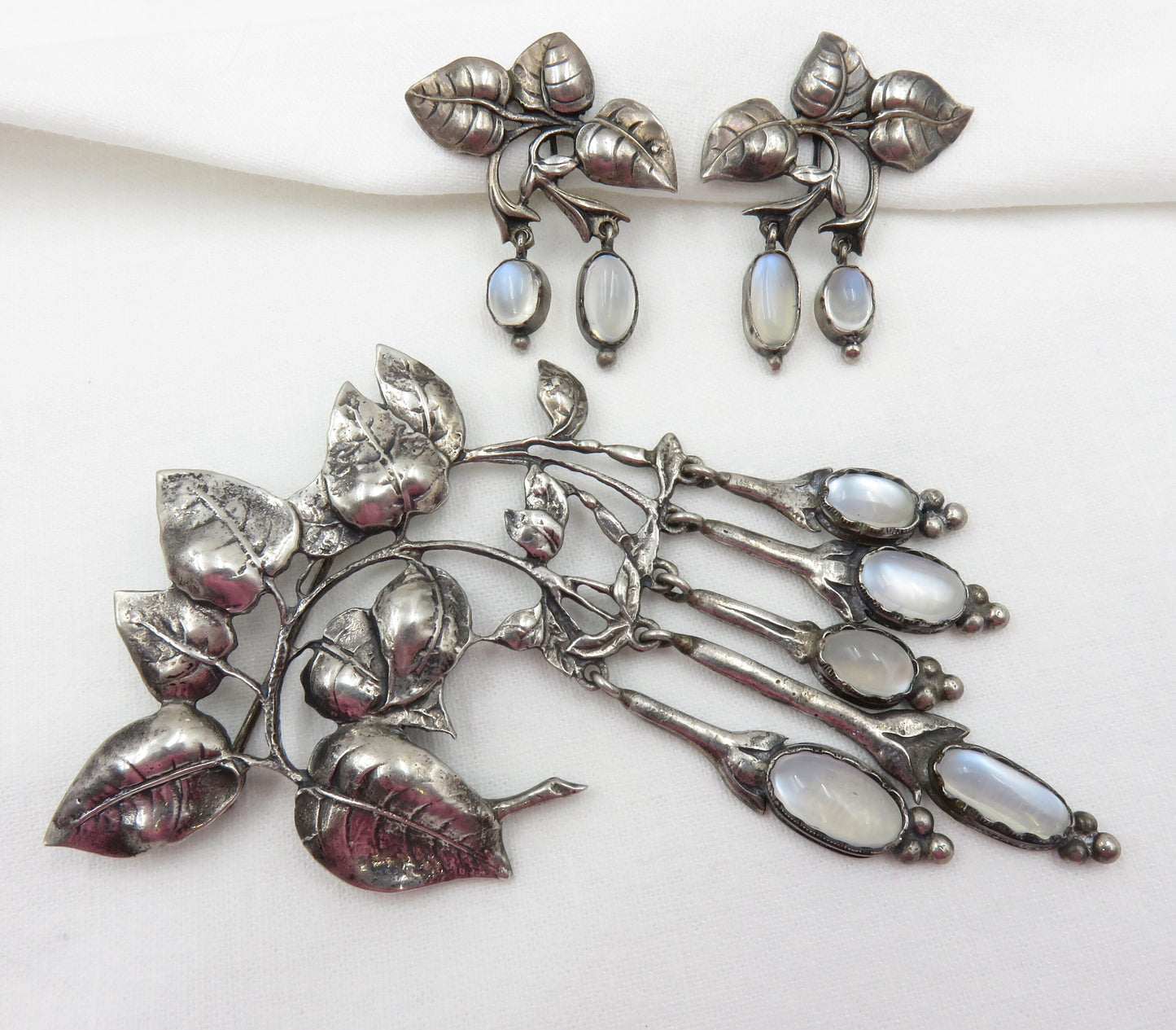 Circa 1940. Silver and Moonstone Brooch and Earring set by Cini