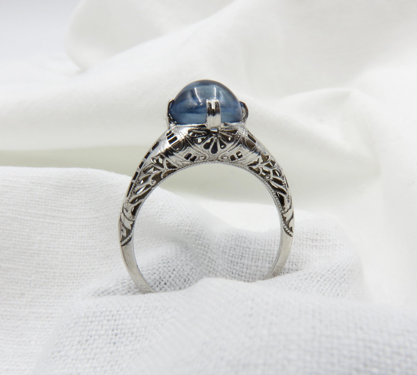 Circa 1930.  Blue Cabochon Sapphire Set In 14KT White Gold