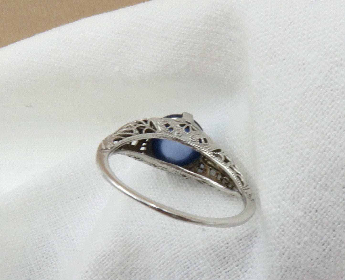 Circa 1930.  Blue Cabochon Sapphire Set In 14KT White Gold