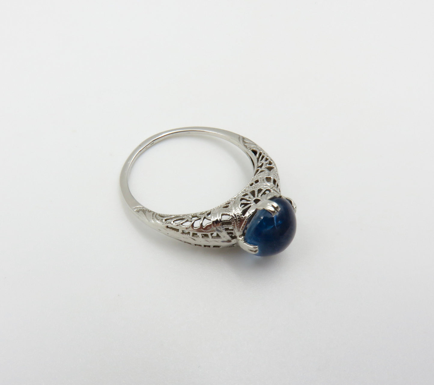 Circa 1930.  Blue Cabochon Sapphire Set In 14KT White Gold