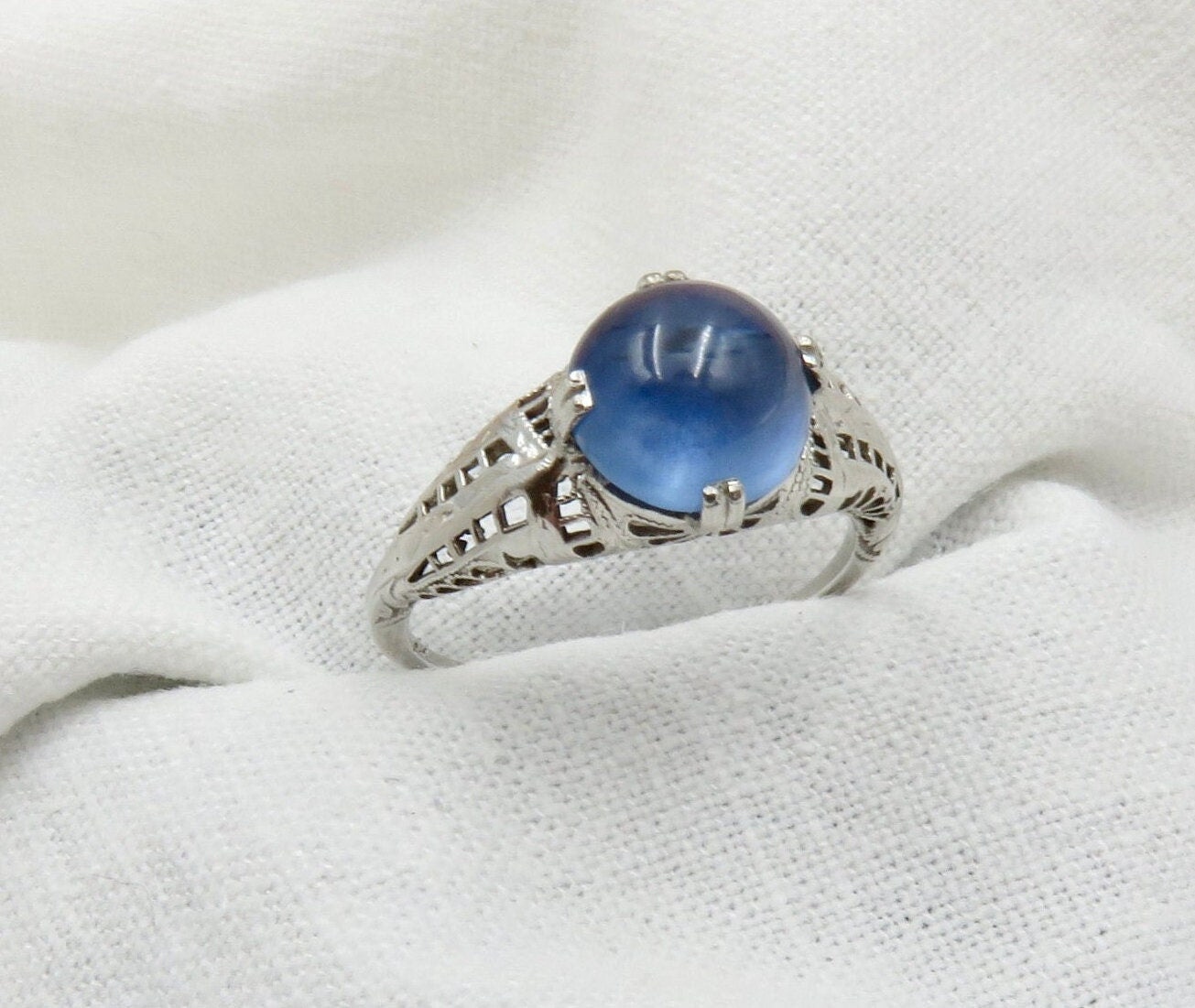 Circa 1930.  Blue Cabochon Sapphire Set In 14KT White Gold