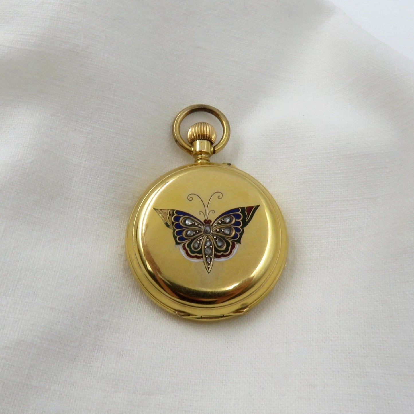 Circa 1900. 18kt Yellow Gold Pocket Watch With Enameled Butterfly and Rose Cut Diamonds