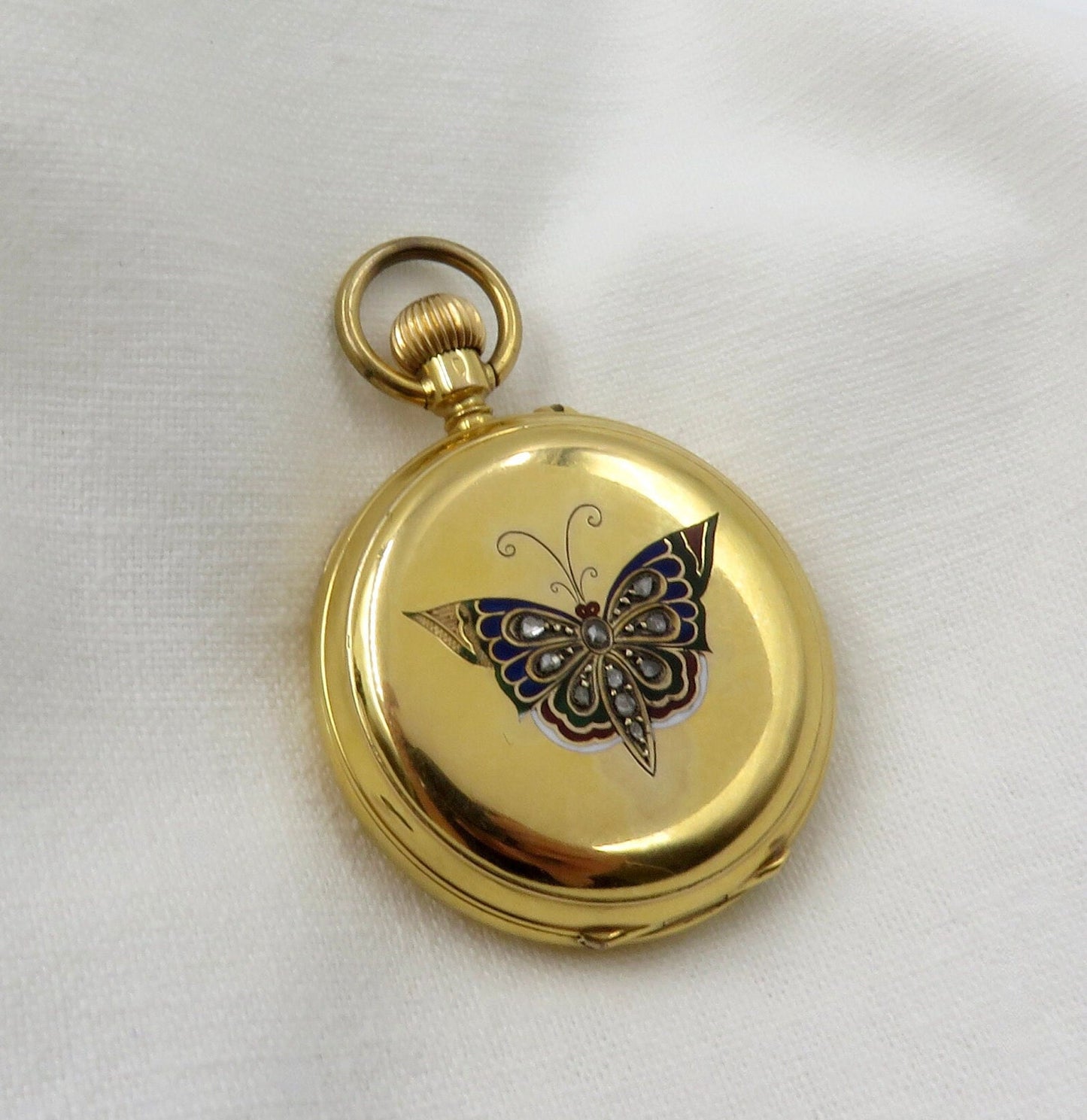 Circa 1900. 18kt Yellow Gold Pocket Watch With Enameled Butterfly and Rose Cut Diamonds