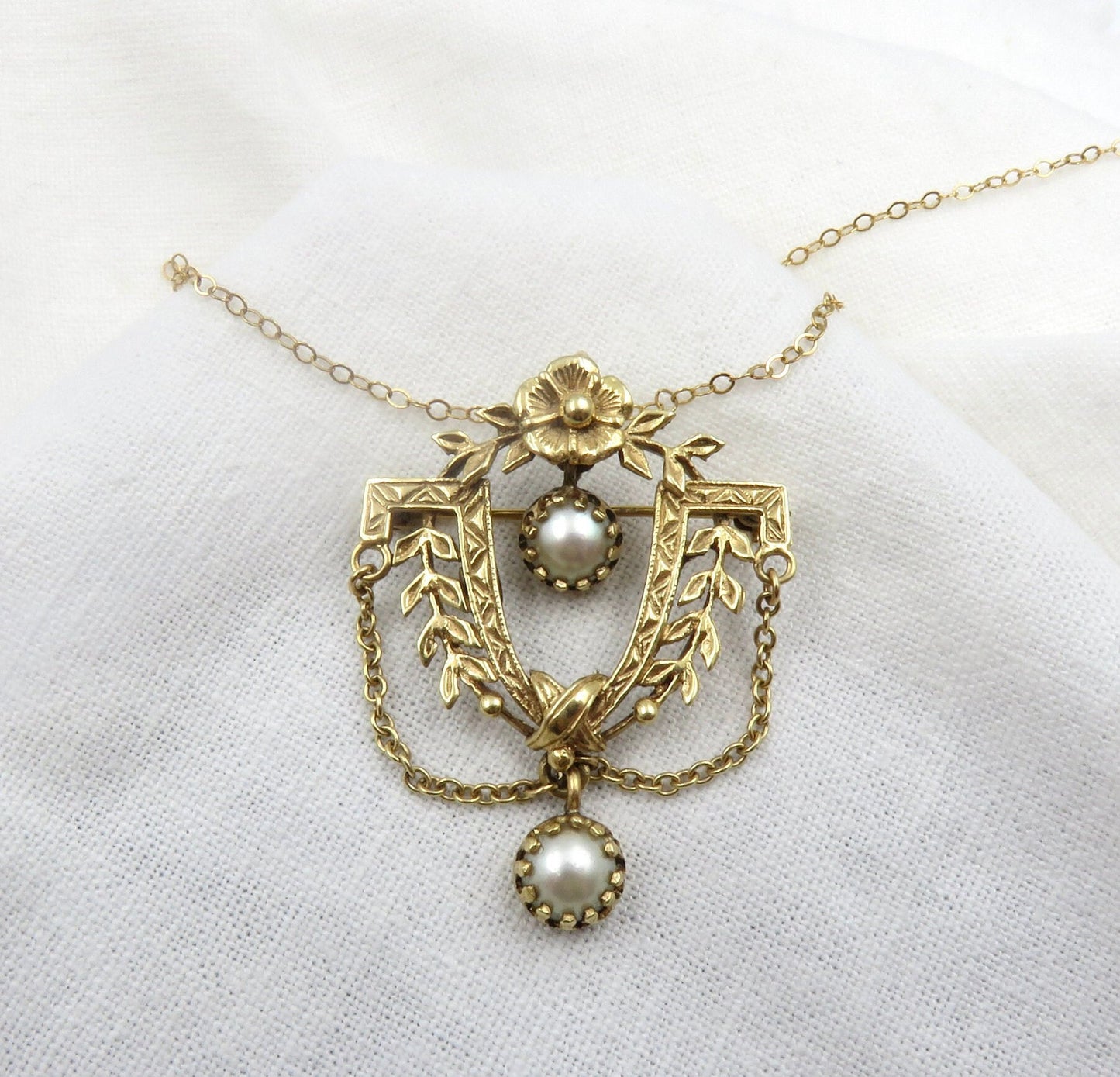 Circa 1900. 14kt Gold and Pearl Pendant Brooch